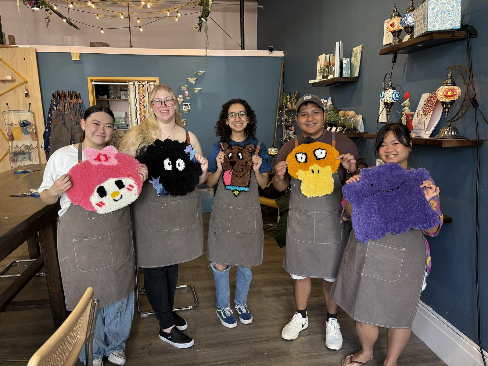 A class holding the rugs they just made